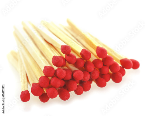 Stack of matchsticks on a white background. Soft focus view.