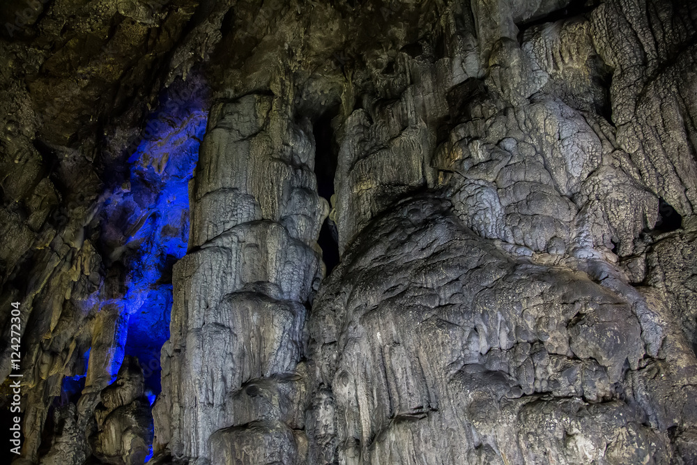 Big Azishskaya cave with speleothem, stalactites, stalagmites and stalagnates