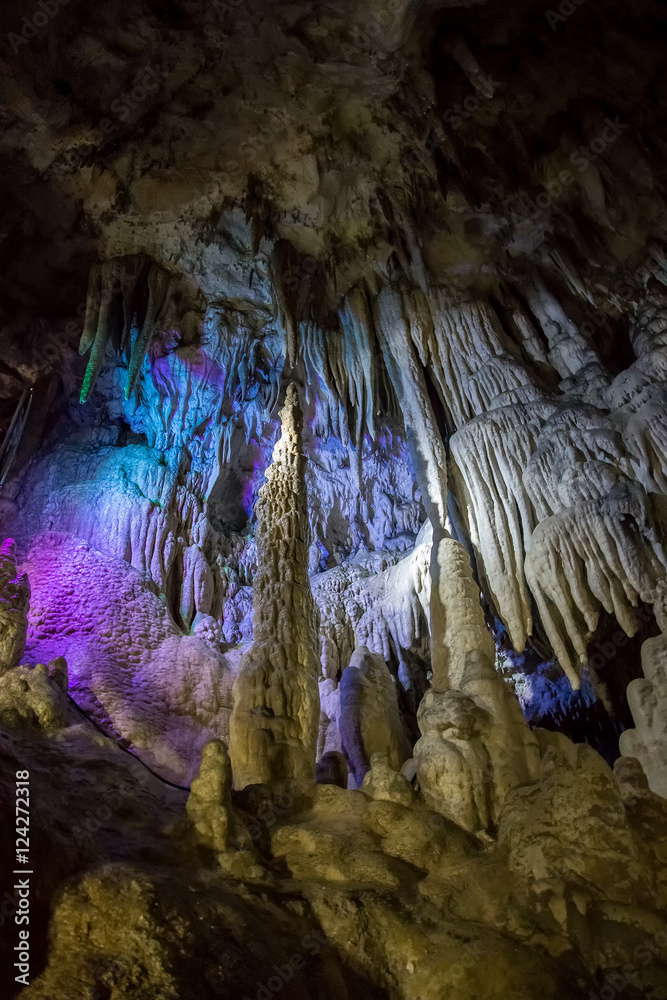 Big Azishskaya cave with speleothem, stalactites, stalagmites and stalagnates