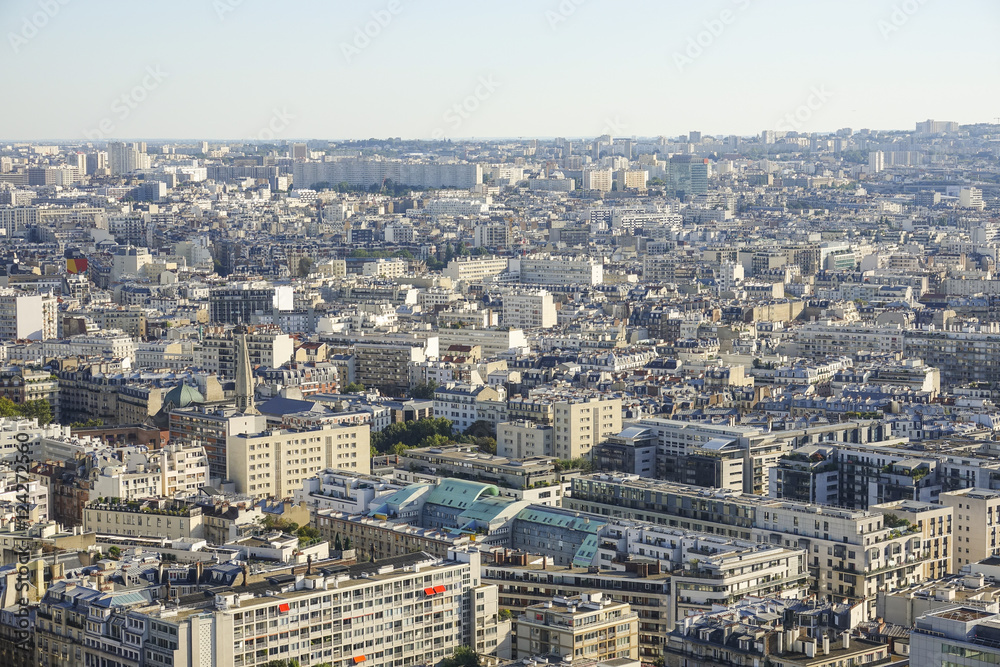 Wide angle view over the city of Paris on a hot summer day - aerial shot