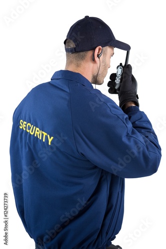 Security officer talking on walkie-talkie