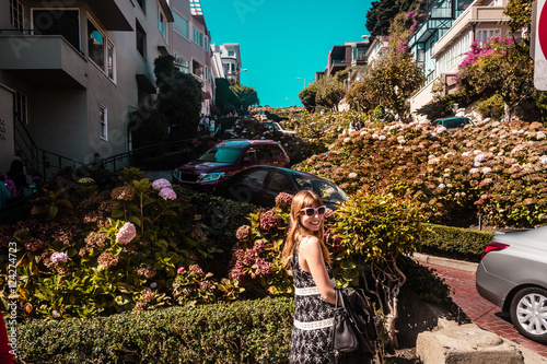 Photography Girl in front of Lombard Street in San Francisco, California