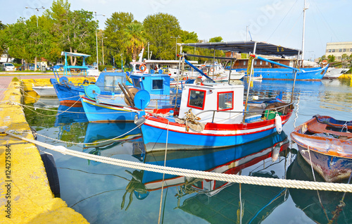 boats reflected on sea at Eleusis port Greece