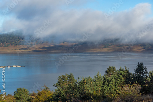 Amazing view of Low clouds over water of Batak Reservoir, Pazardzhik Region, Bulgaria