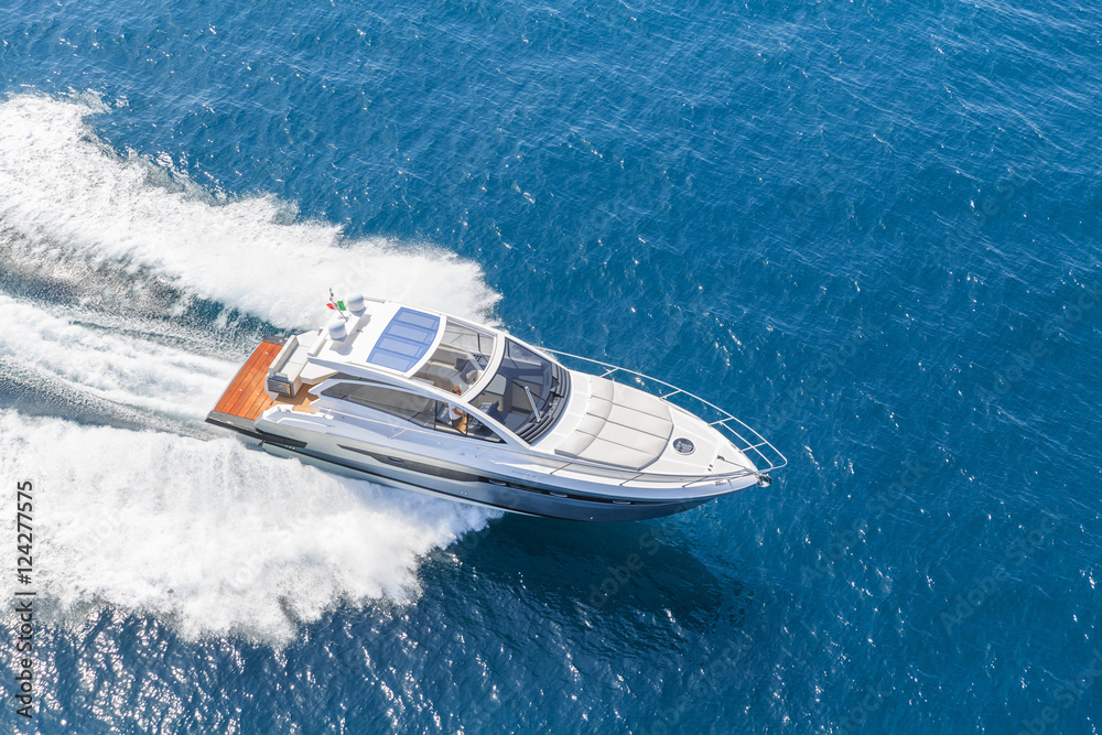 Fototapeta premium luxury motor boat, rio yachts italian shipyard, aerial view