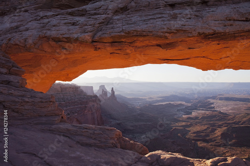 The lower arch glows a brilliant orange as the sun rises over mesa arch in canyonlands national park;Moab utah united states of america
