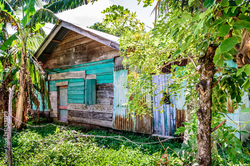 Ramshackle wooden cabin in Caribbean town in Guatemala photo