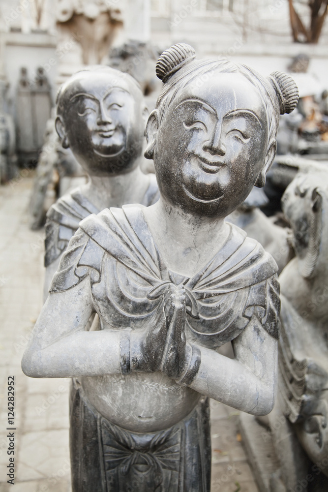 Statues of traditional chinese man and woman;Beijing china Statues of traditional chinese man and woman;Beijing china