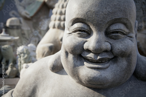 Smiling stone buddha statue;Beijing china photo