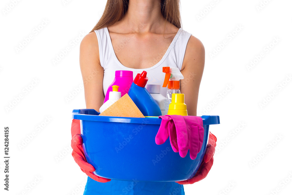 Woman holding cleaning things in washbowl Woman holding cleaning things in washbowl