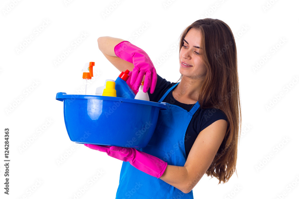 Woman holding cleaning things in washbowl Woman holding cleaning things in washbowl