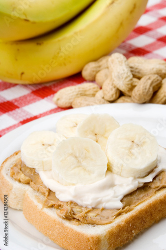 Peanut Butter, Mayonnaise and Banana Sandwich – An open-faced sandwich made of white bread, peanut butter, mayonnaise and sliced bananas.