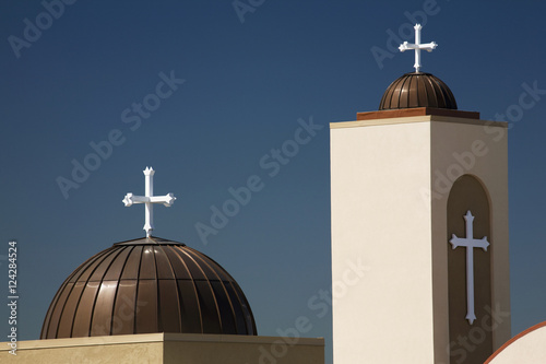 A coptic orthodox church tower and dome with blue sky;Alberta canada