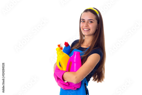 Woman in apron holding a detergents