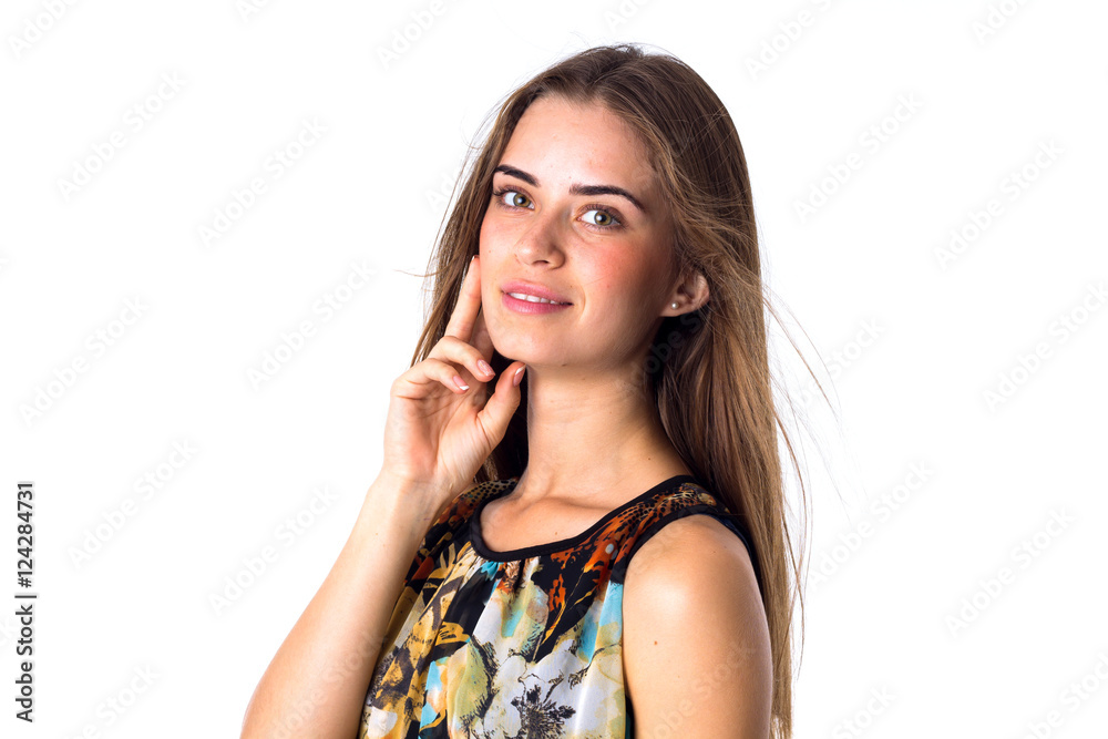 Young woman smiling and holding hand at her cheek Young woman smiling and holding hand at her cheek