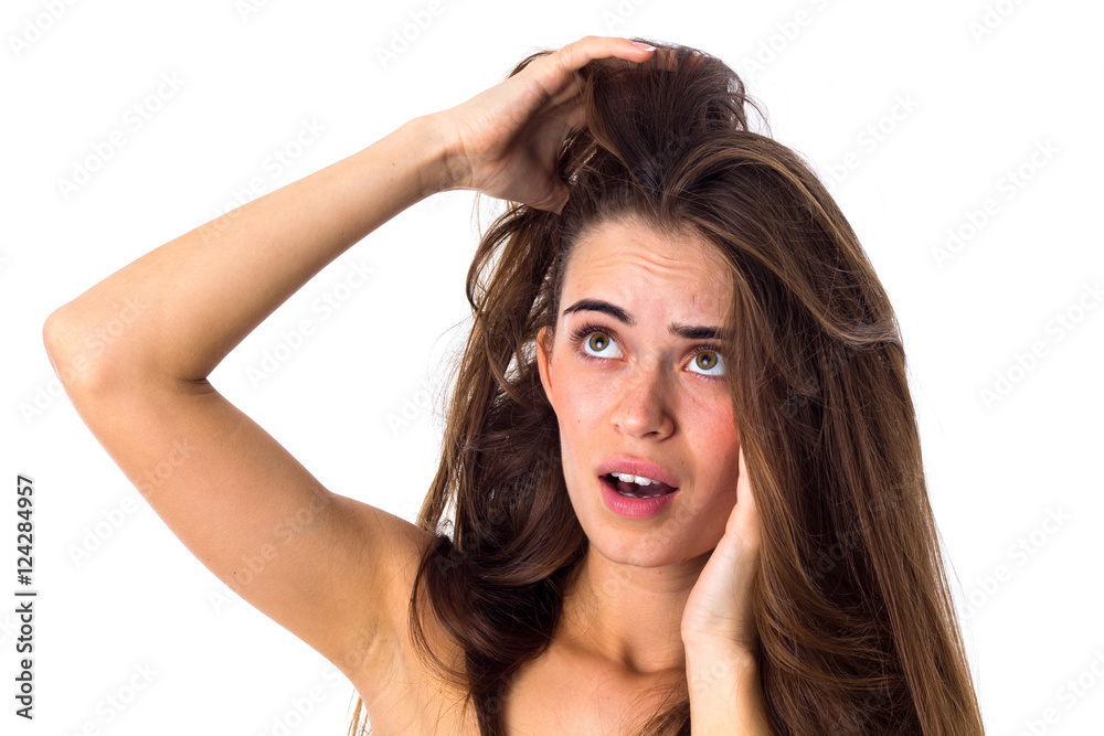 Woman touching her tangled hair