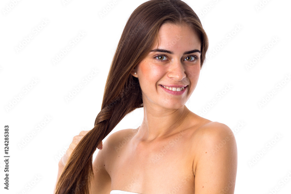 Fototapeta premium Young woman making a plait