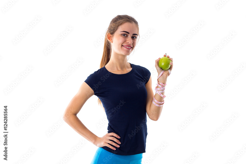 Woman with centimeter holding an apple 