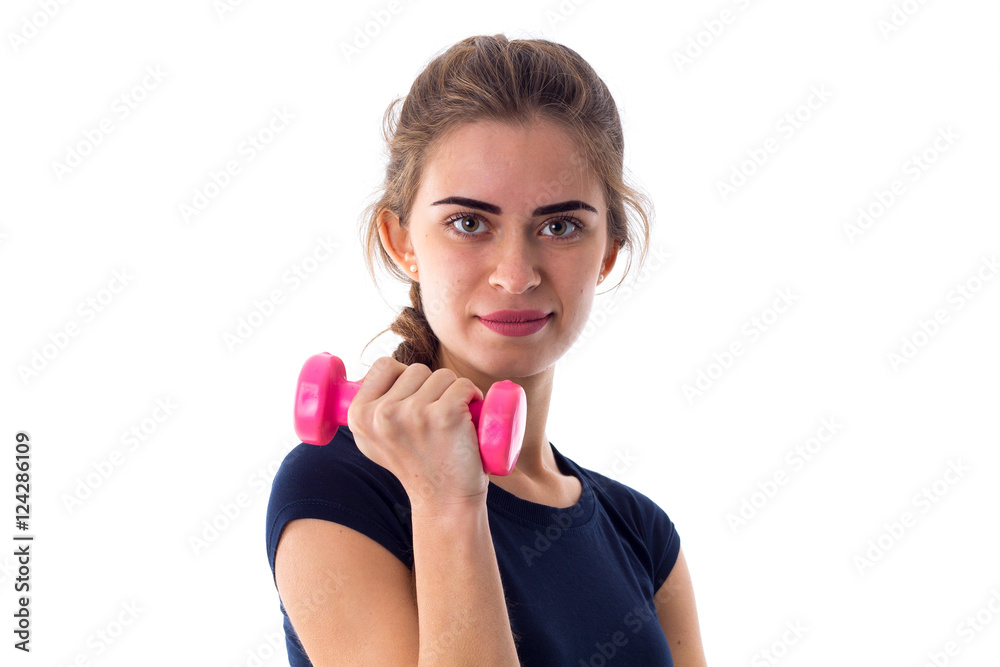 Woman holding a pink dumbbell Woman holding a pink dumbbell
