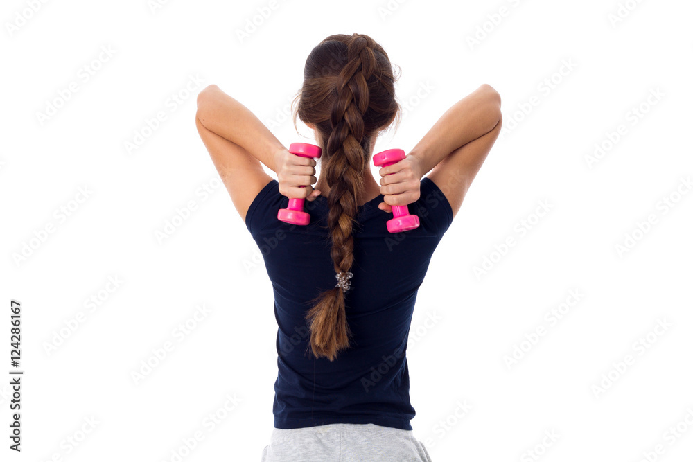 Woman holding two pink dumbbells Woman holding two pink dumbbells