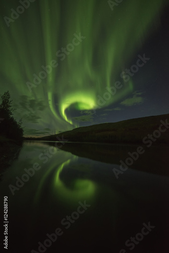 Northern Lights (aurora borealis) over the Pelly River; Ross River, Yukon, Canada photo