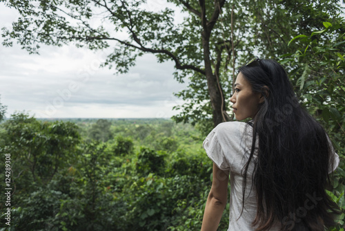 Portrait of a young woman in Phnom Bakheng, ancient buddhist temple from the famous Angkor area; Siem Reap, Cambodia photo