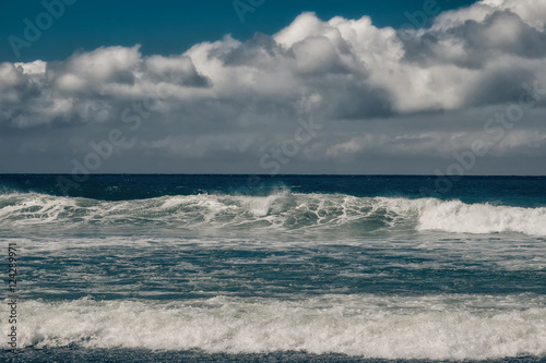 Stormy ocean landscape with rainy clouds