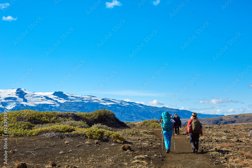 Fototapeta premium woman hikers on the trail, hiking in Iceland