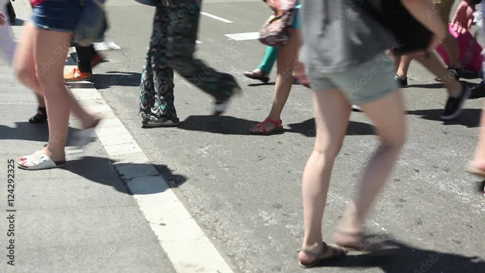 crowd of anonymous people crossing zebra crossing on busy city center centre sunny tourist commuters cars bus motorcycle scooter shopping bags business man woman crowd of anonymous people crossing zebra crossing on busy city center centre sunny tourist commuters cars bus motorcycle scooter shopping bags business man woman