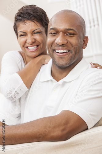 Happy African American Woman Couple Sitting At Home © Darren Baker