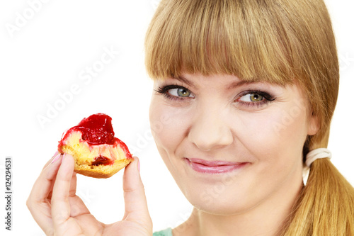 Woman eating cupcake sweet food