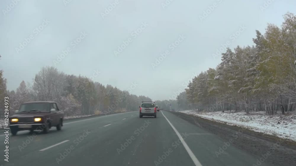Early snow in October in Siberia, commuter highway Early snow in October in Siberia, commuter highway