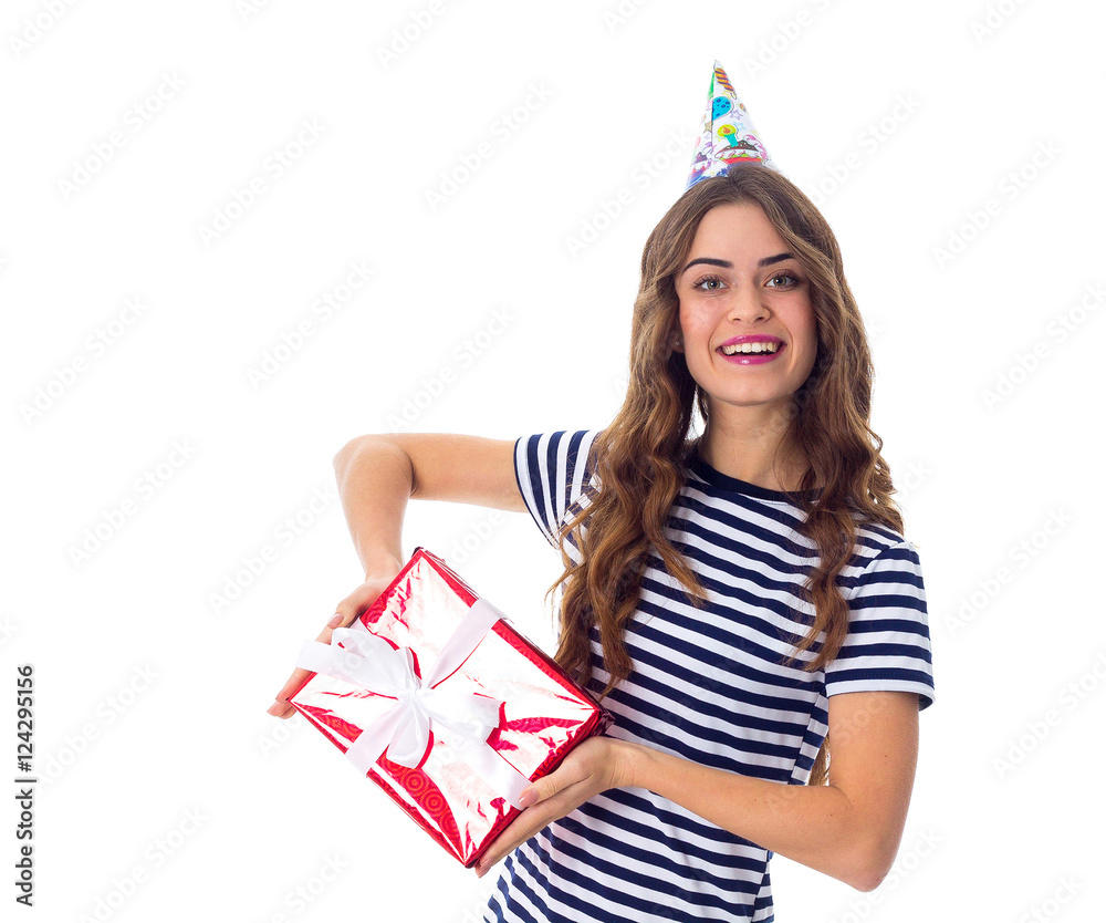 Woman in celebration cap holding a present Woman in celebration cap holding a present