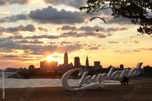 Morning view of Cleveland skyline, Lake Erie, and paraglider from Edgewater park