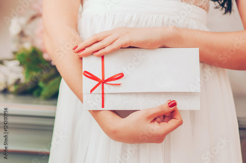 Gift card - closeup of woman showing sign card.