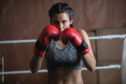 Portrait of woman in boxing gloves