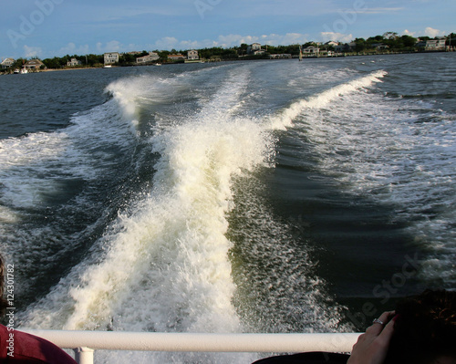 The wake from behind a water taxi photo