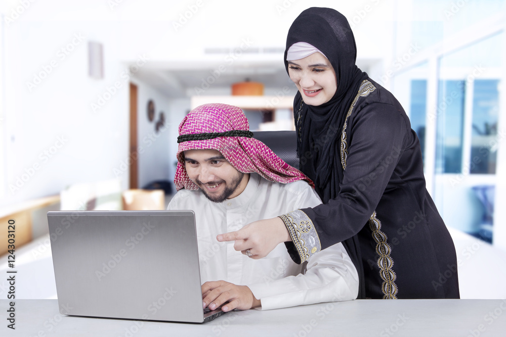 Arabian family working together at home