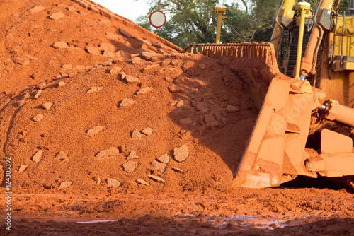 Bauxite mining in Weipa, Queensland, Australia Bauxite is an aluminium ore and is the main source of aluminium. Big bucket scoop bulldozer mining technology using to move bauxite mine.