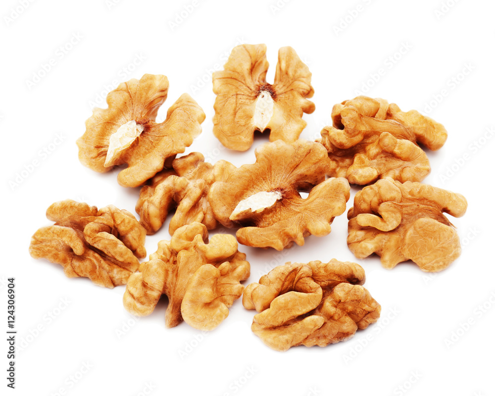 Heap of fresh shelled walnuts on white background. Close-up. Heap of fresh shelled walnuts on white background. Close-up.