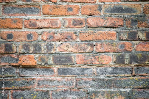 Old, crumbly and burnt bricks wall. Background. © fotoduets
