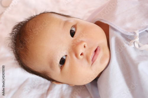 Asian baby in face a suspicion are development of Learning.