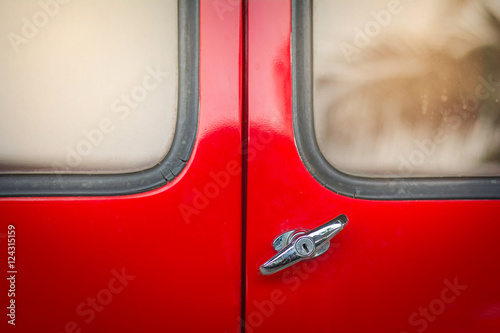 detail of vintage red car door