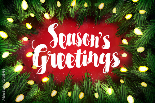 Season's greetings Christmas greeting card with pine wreath and