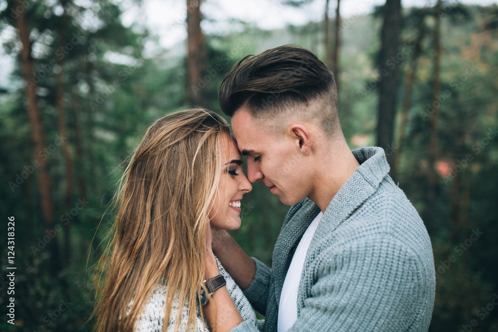 Fototapeta premium Stylish and fashionable young beautiful happy couple posing. Boho style.