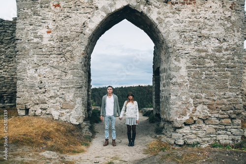 Stylish and fashionable young beautiful happy couple posing. Boho style.