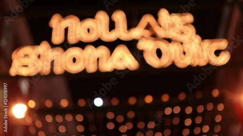 Christmas decorations and lights at busy city center looking for presents sales window shop shopping festive seasonal celebration