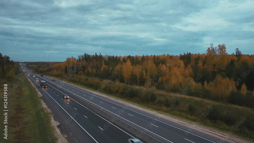 Aerial shot automobile highway on background of autumn forest Aerial shot automobile highway on background of autumn forest