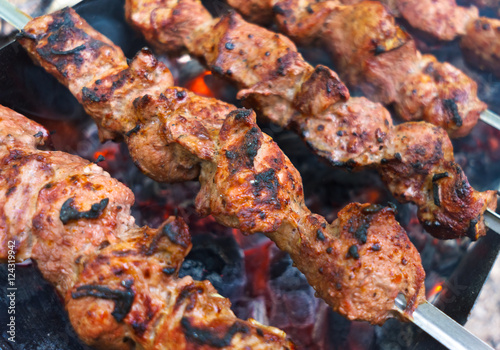 Grilling marinated meat on a grill