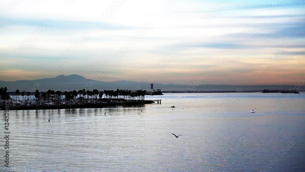 Beauty shot of seascape with mountain range in background. Beauty shot of seascape with mountain range in background.